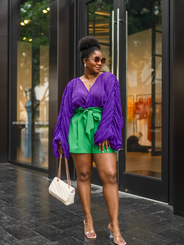 Purple statement sleeve top paired with green paperbag shorts, perfect for spring brunch