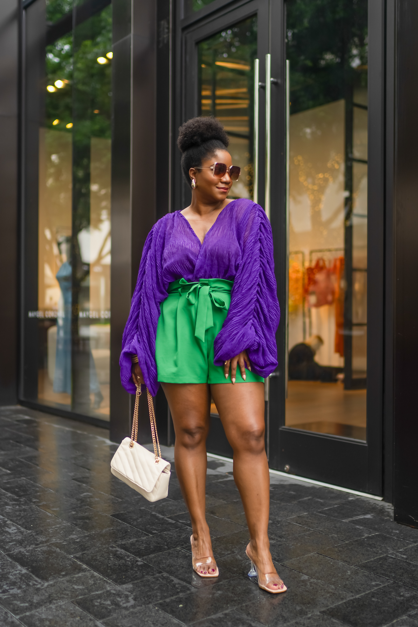 Purple statement sleeve top paired with green paperbag shorts, perfect for spring brunch