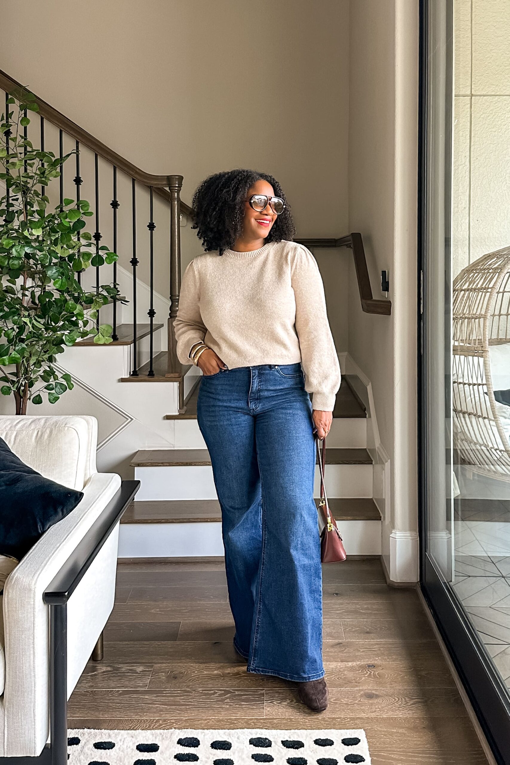 holiday outfit ideas styling tall boots jeans and sweater